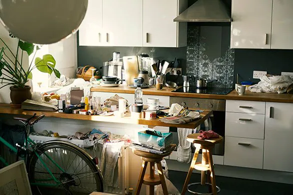 A kitchen being tidied during an evening reset
